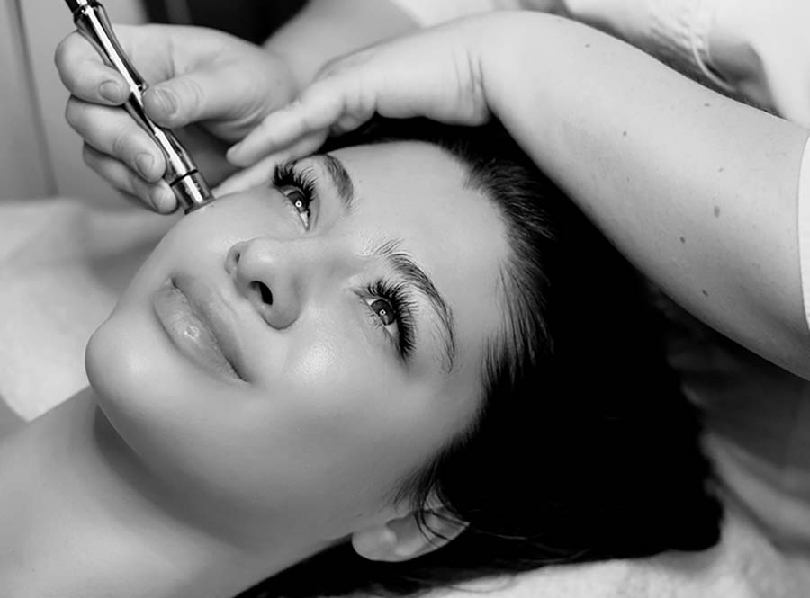 Dr. Burke Facial Plastic Surgery Relaxed Woman Spa Microdermabrasion