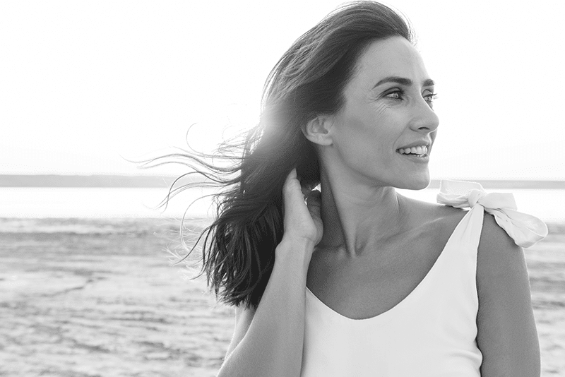 Middle aged woman outside beach