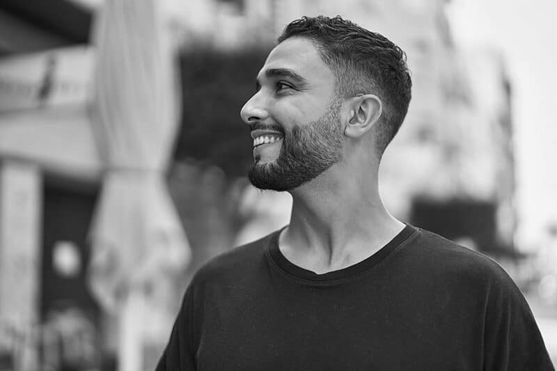 handsome man outside smiling e1675363546562